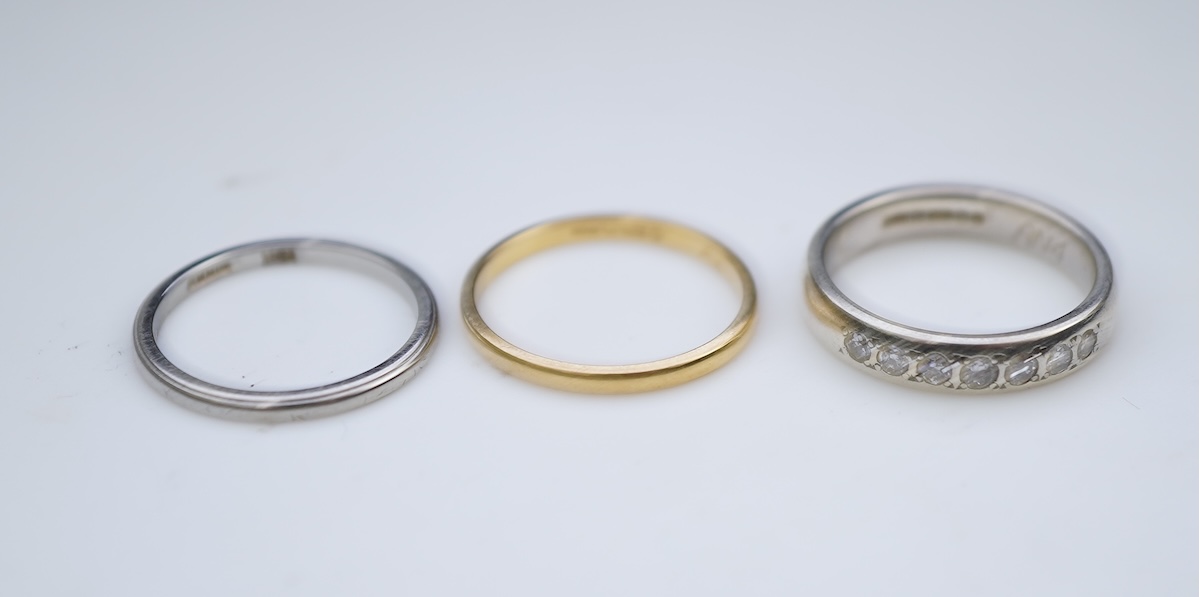 A diamond ring and two gold wedding rings